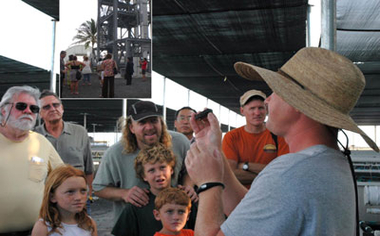 image of a tour guide speaking to a group of people